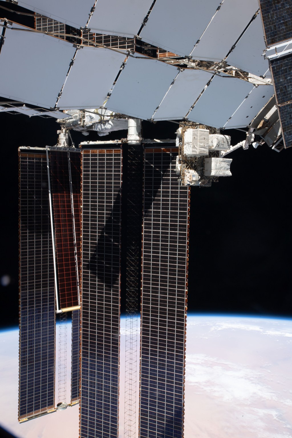 The second ISS Roll-Out Solar Array (iROSA) is pictured after completing its roll out on the International Space Station's Port-6 truss structure's 2B power channel