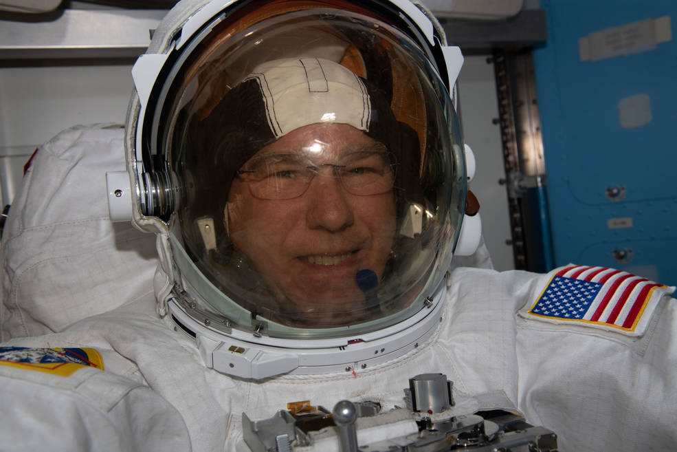 NASA astronaut Steve Bowen prepares for a spacewalk in the International Space Stations Quest airlock during Expedition 69.