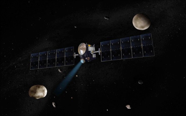 Artist's concept of NASA's Dawn spacecraft. The giant asteroid Vesta, Dawn's next destination, is on the lower left. Another larger asteroid and Dawn's second destination, Ceres, is on the upper right.