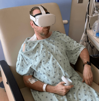 A patient experiencing balance issues wears video goggles for measuring head and eye movements. The dial he’s holding allows him to rate his levels of motion sickness as he tests out different head motions. A similar setup will be used on riders just after they exit the Kraken.