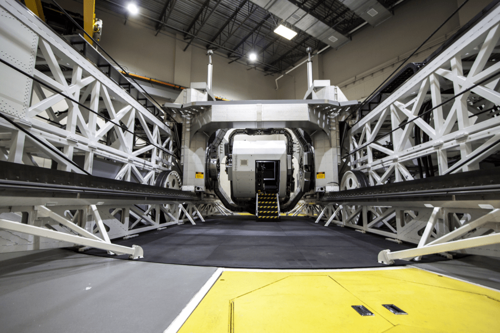 A view of the cockpit of the Kraken, a device that can be configured to disorient those strapped inside. The parallel tracks on the left and right allow the cockpit to lurch forward and backward while it independently spins.