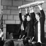 William Pickering, the director of NASA's Jet Propulsion Laboratory, scientist James Van Allen and rocket pioneer Wernher von Braun hold up a model of the Explorer 1 spacecraft during a press conference for the satellite's successful launch into space.