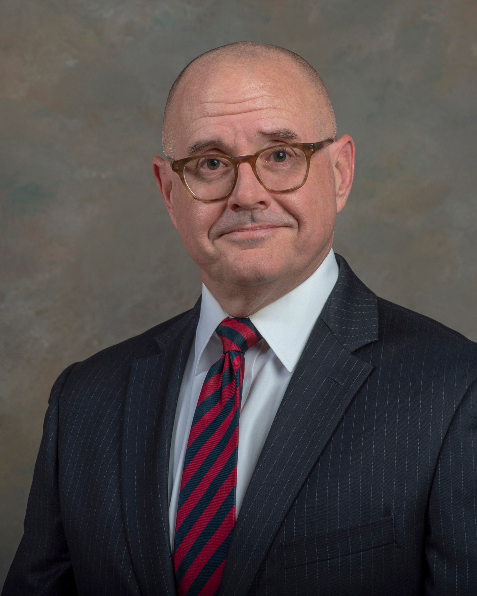 Portrait of a man in a suit and tie his name is Kent Chojnacki