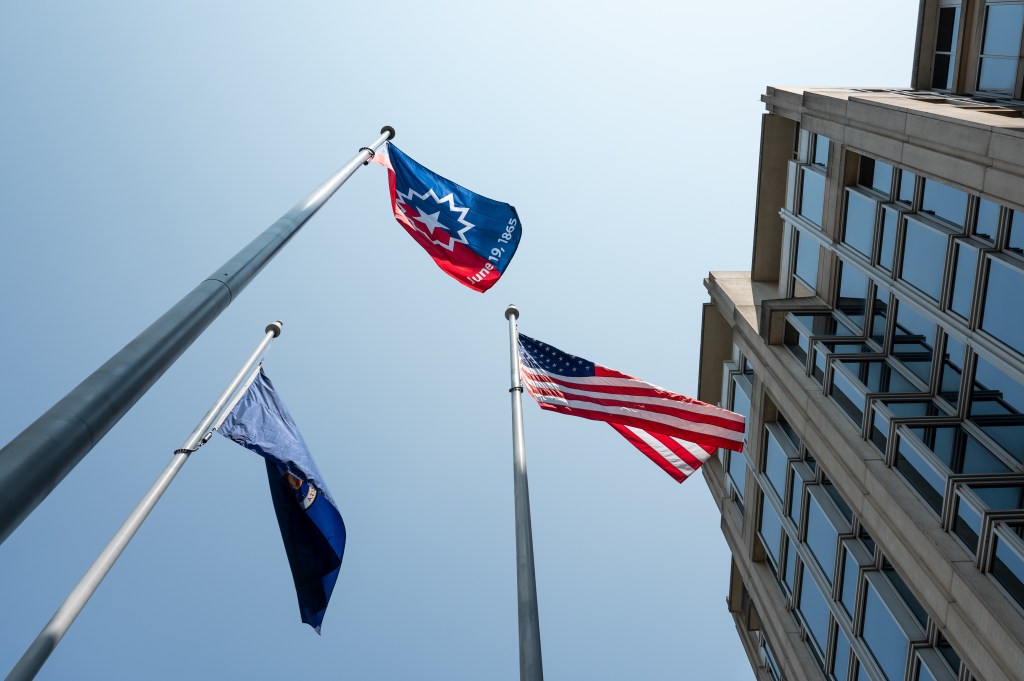The Juneteenth flag is seen waving in the wind during a flag raising ceremony in recognition and celebration of Juneteenth, Thursday, June 15, 2023, at the Mary W. Jackson NASA Headquarters building in Washington.