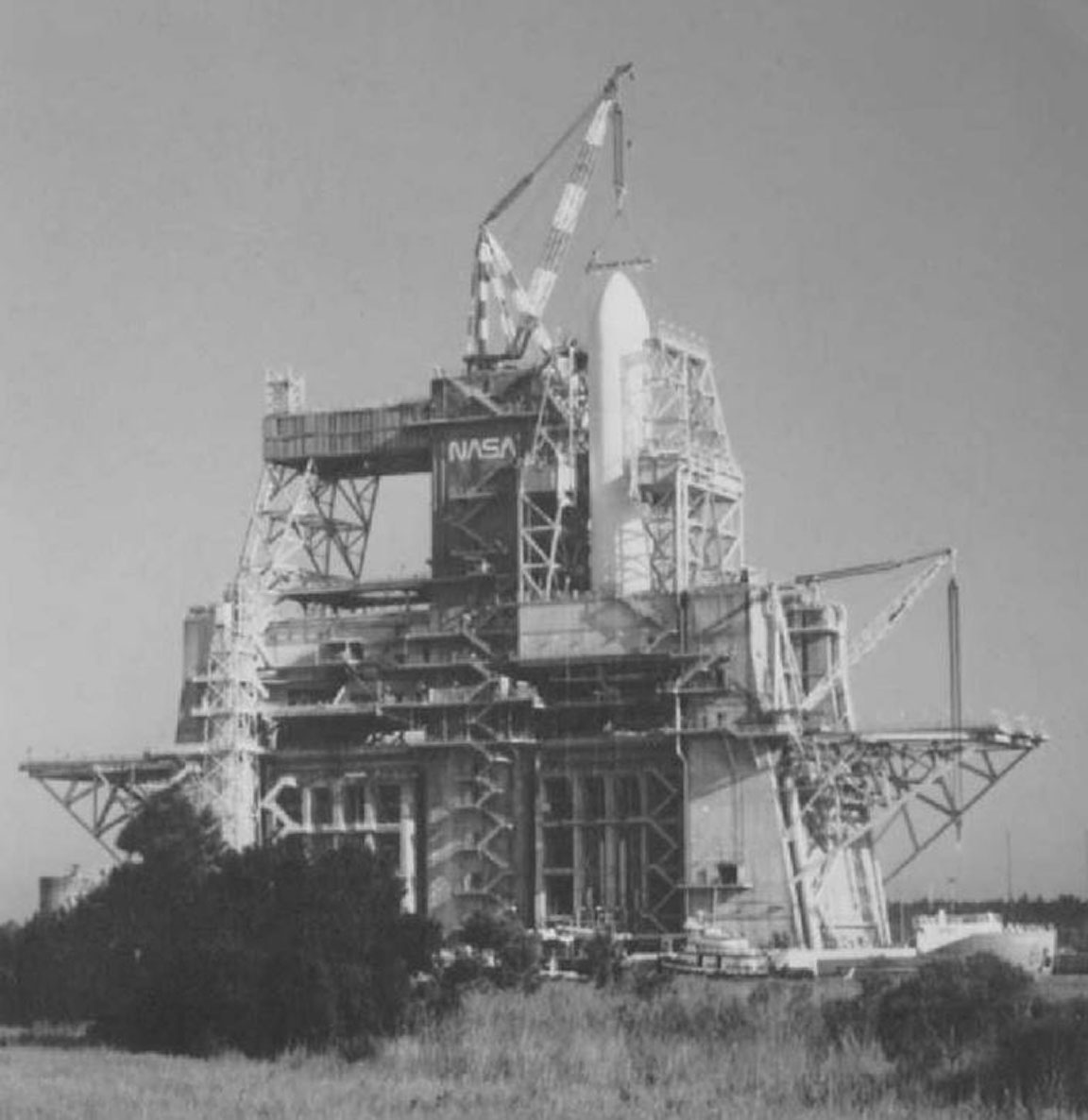 Teams install the space shuttle external tank on the B-2 Test Stand at NASA’s Stennis Space Center prior to the start of testing on the vehicle main propulsion system in April 1978