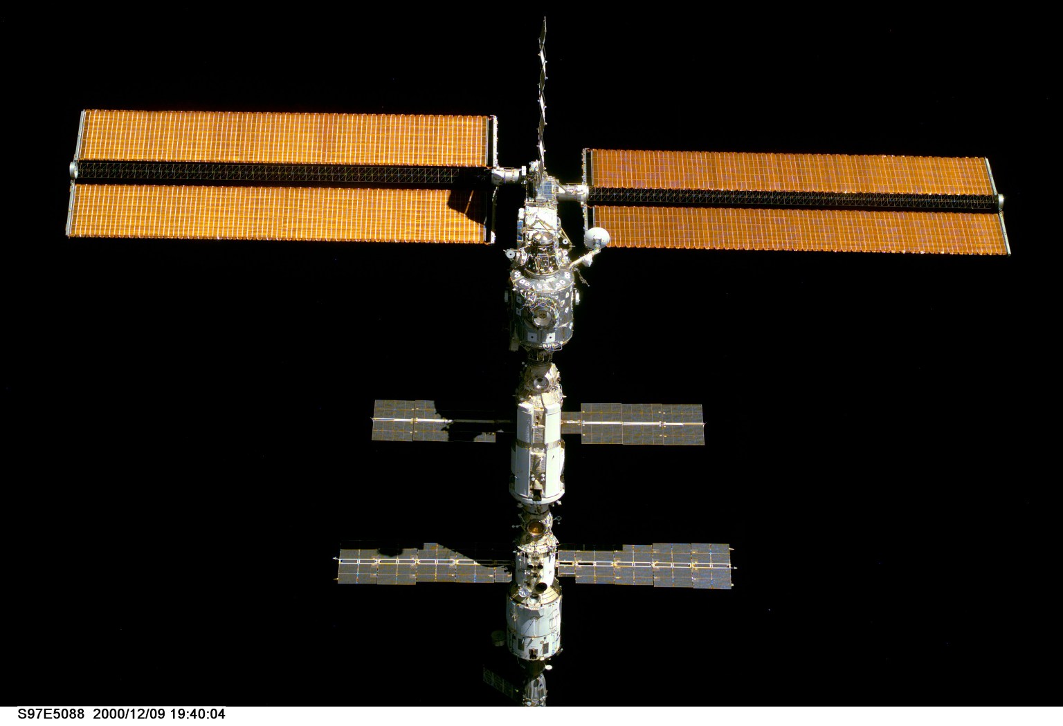 This view of the International Space Station's new P6 (Port) truss and its solar arrays was pictured from space shuttle Discovery after it undocked on Dec. 9, 2000.