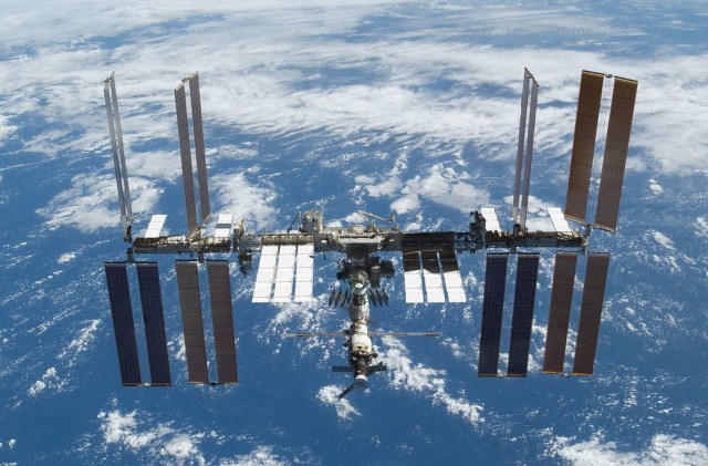 View of the International Space Station (ISS) with Earth in the backdrop as seen from an approaching vehicle.