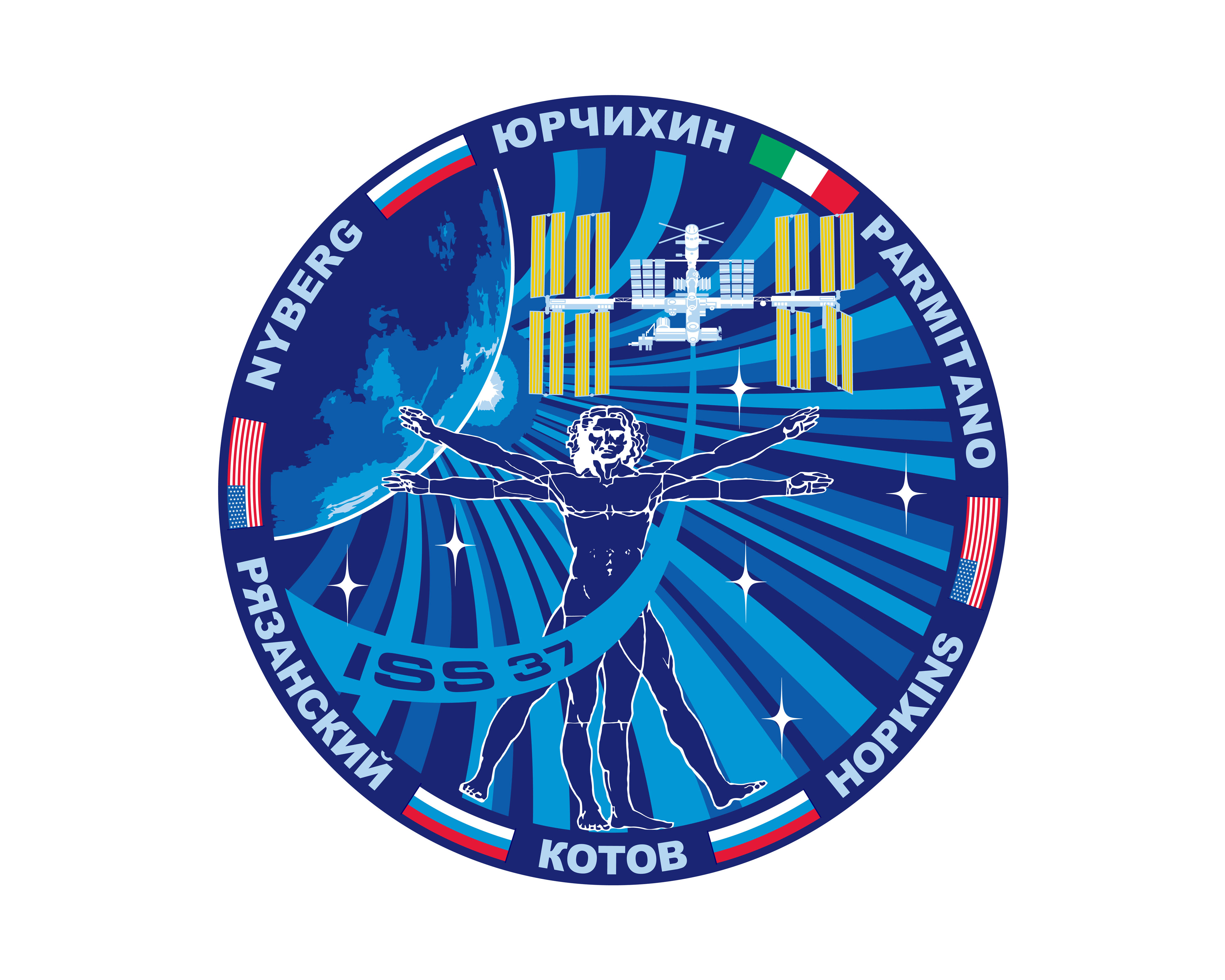 A round image with an image of the space station, the Earth and the drawing of man by leonardo DiVinci, The outside of the circle has the names of the crew members with images of  the flags from the country they represent.