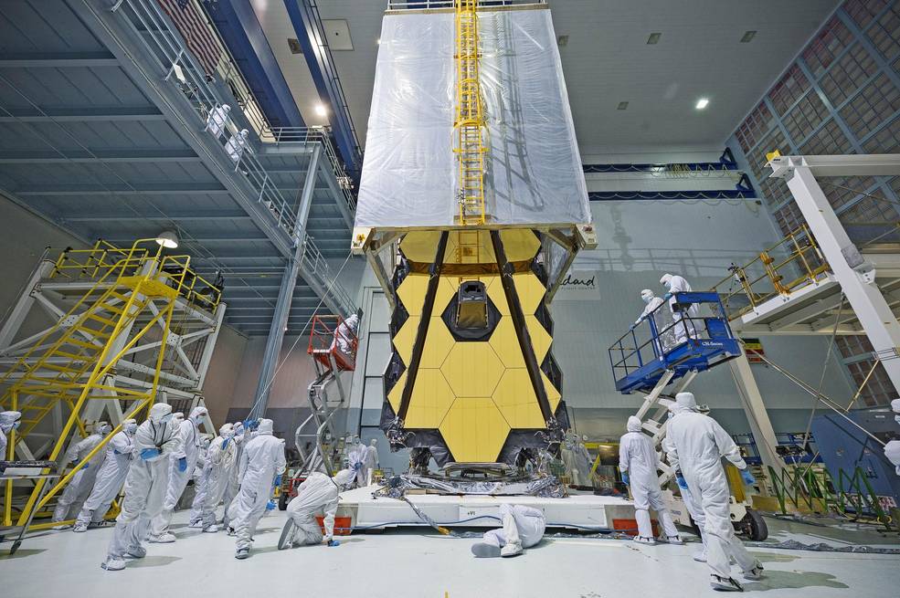 Engineers monitor as NASA's James Webb Space Telescope is enclosed in a "clean tent" to protect the telescope from dust and dirt during testing at NASA's Goddard Space Flight Center in Greenbelt, Maryland.