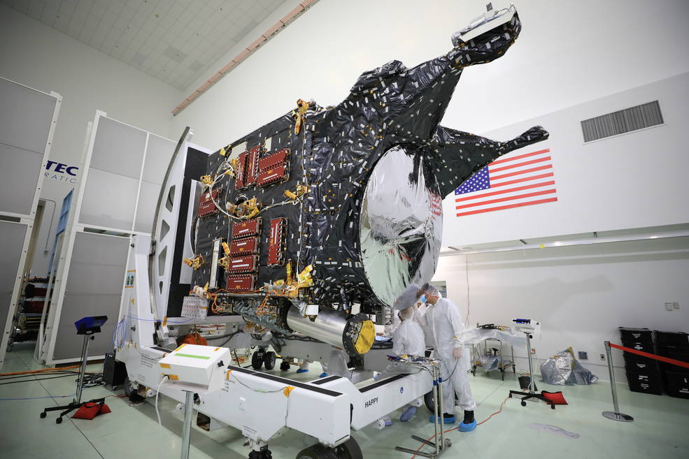 A team prepares NASAs Psyche spacecraft for launch inside the Astrotech Space Operations Facility near the agencys Kennedy Space Center in Florida .