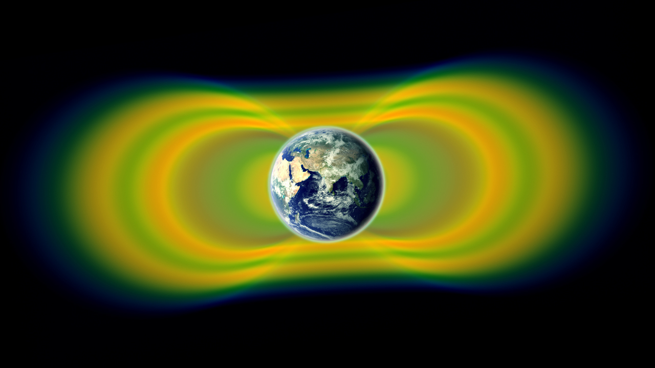The Earth surrounded by belts of yellow and green