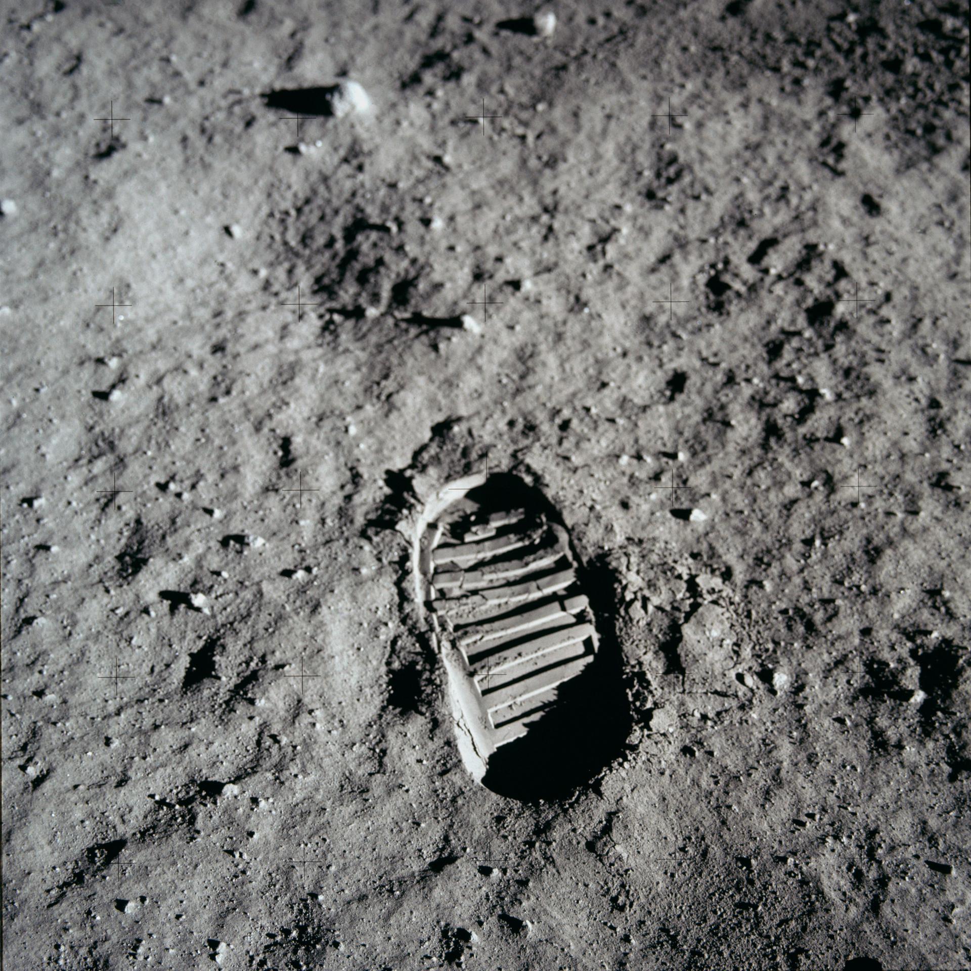 A close-up view of an astronaut's boot print in the lunar soil, photographed with a lunar surface camera during the Apollo 11 extravehicular activity (EVA) on the Moon.