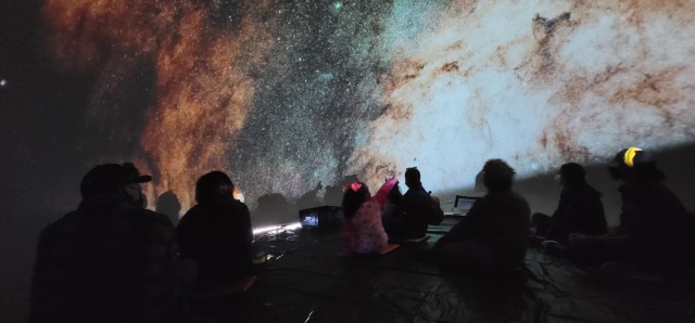 Families enjoy a virtual trip through space in the  Astro-Dome