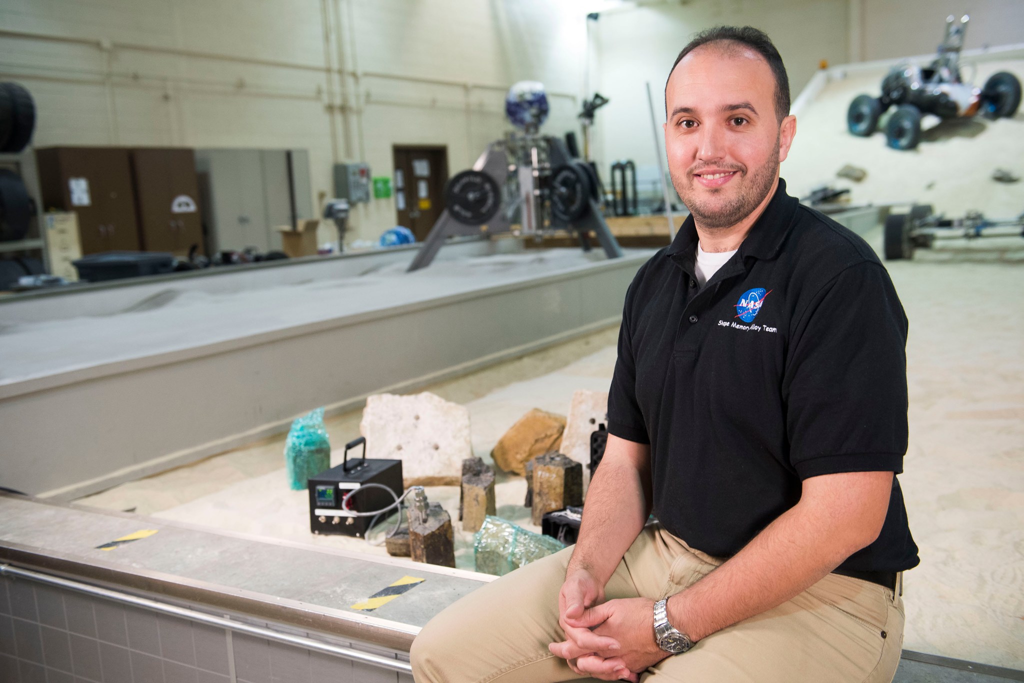  Othmane Benafan smiles for the camera. He has created a rock splitter that will help NASA explore the rocky surface of Mars 