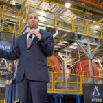 NASA Administrator Jim Bridenstine gives remarks on the agencys Artemis program, Monday, Dec. 9, 2019, in front of the core stage for NASAs Space Launch System (SLS) rocket at NASAs Michoud Assembly Facility in New Orleans. Through Artemis NASA will land the first woman and next man on the Moon by 2024. Photo Credit: (NASA/Bill Ingalls)