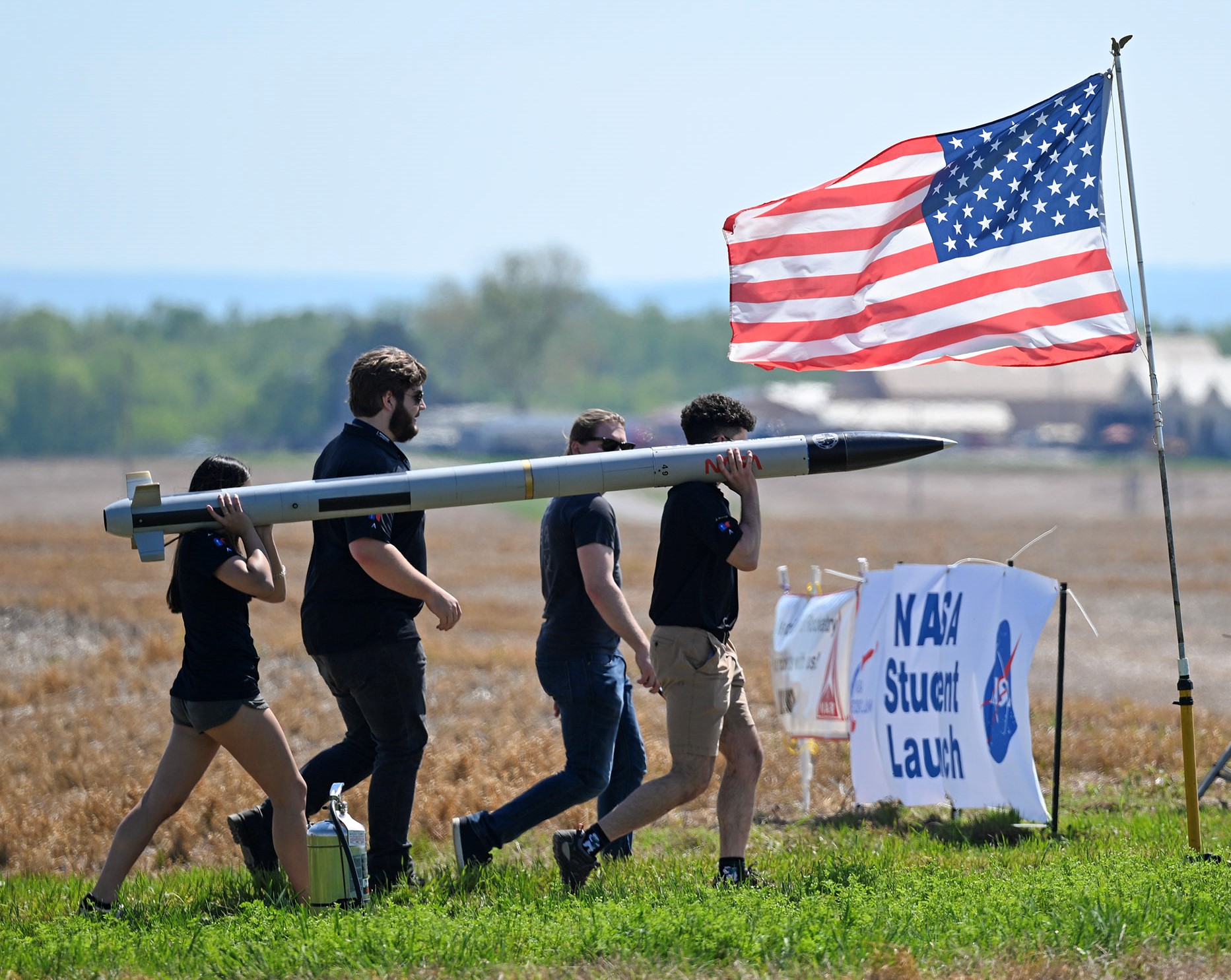Students from the University of North Carolina at Charlotte, carry their rocket to the launch pad during NASAs 2023 Student Launch competition near NASAs Marshall Space Flight Center in Huntsville, Alabama, April 15.