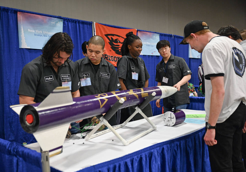 Students from New York University, in the Bronx, showcase their rocket during NASAs annual Rocket Fair April 13, near NASAs Marshall Space Flight Center in Huntsville, Alabama.