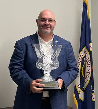 Marshall Space Flight Center Deputy Director Joseph Pelfrey holds the NASA Small Business Administrators Cup Award. Marshall has won the Cup seven times.