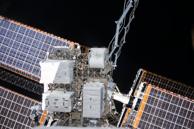 Photograph of a solar array and an EXPRESS (Expedite the Processing of Experiments to Space Station) Logistics Carrier-1 (ELC-1) taken by an Expedition 42 crew member aboard the International Space Station.