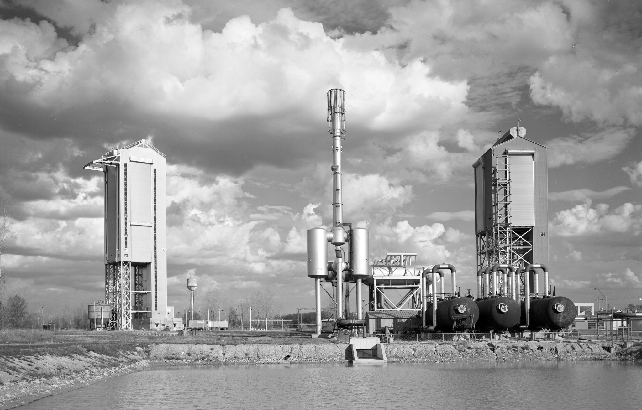 Two test stands with pond in foreground.