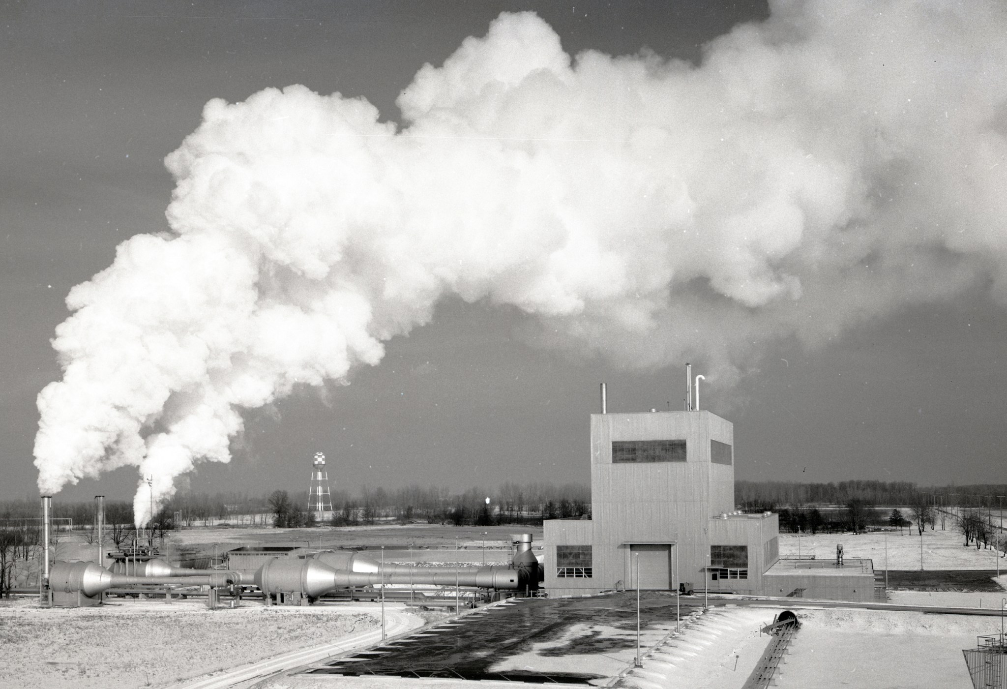 Exterior of test site with steam venting into the air.