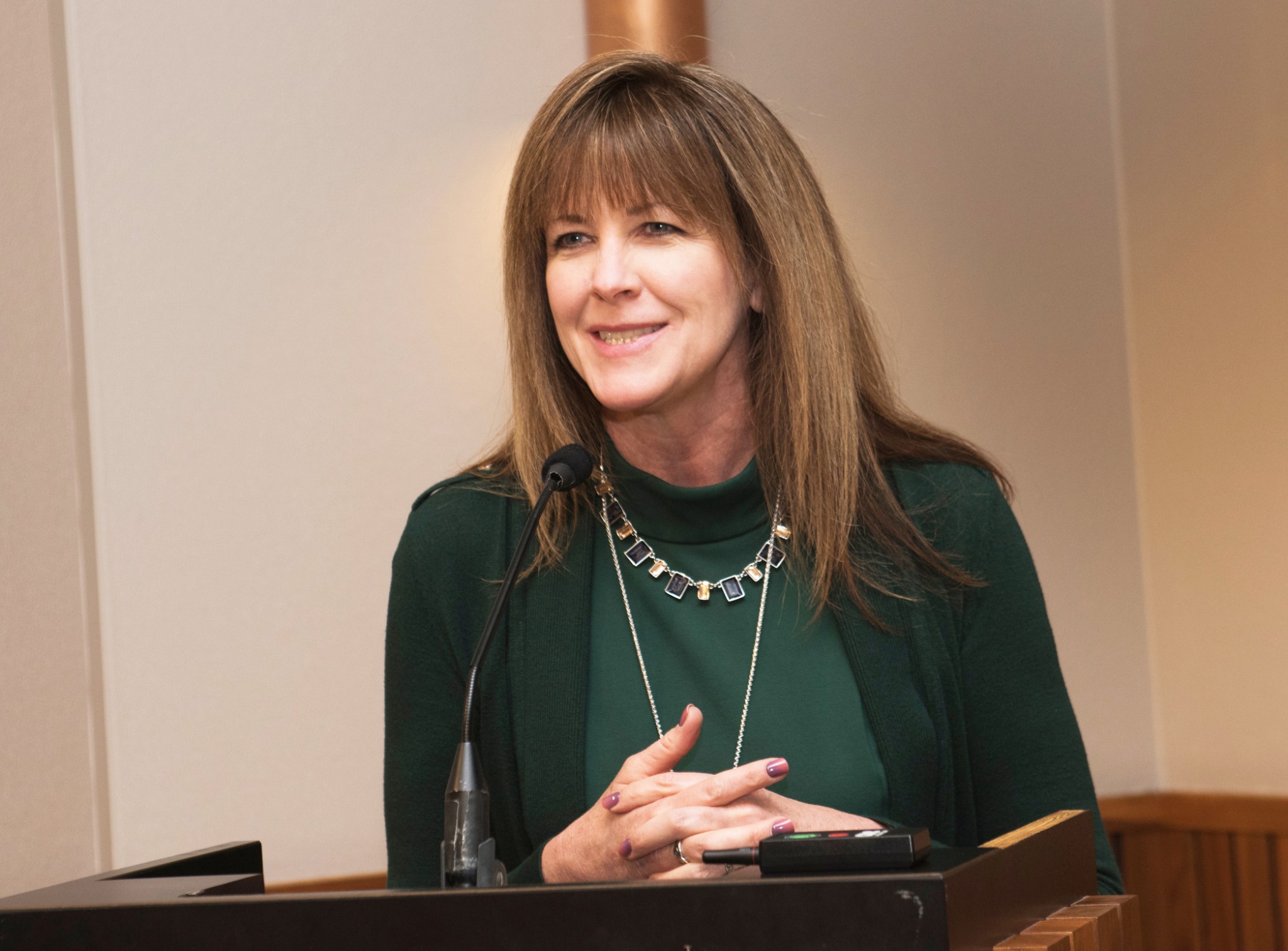 Janet Kavandi at podium.