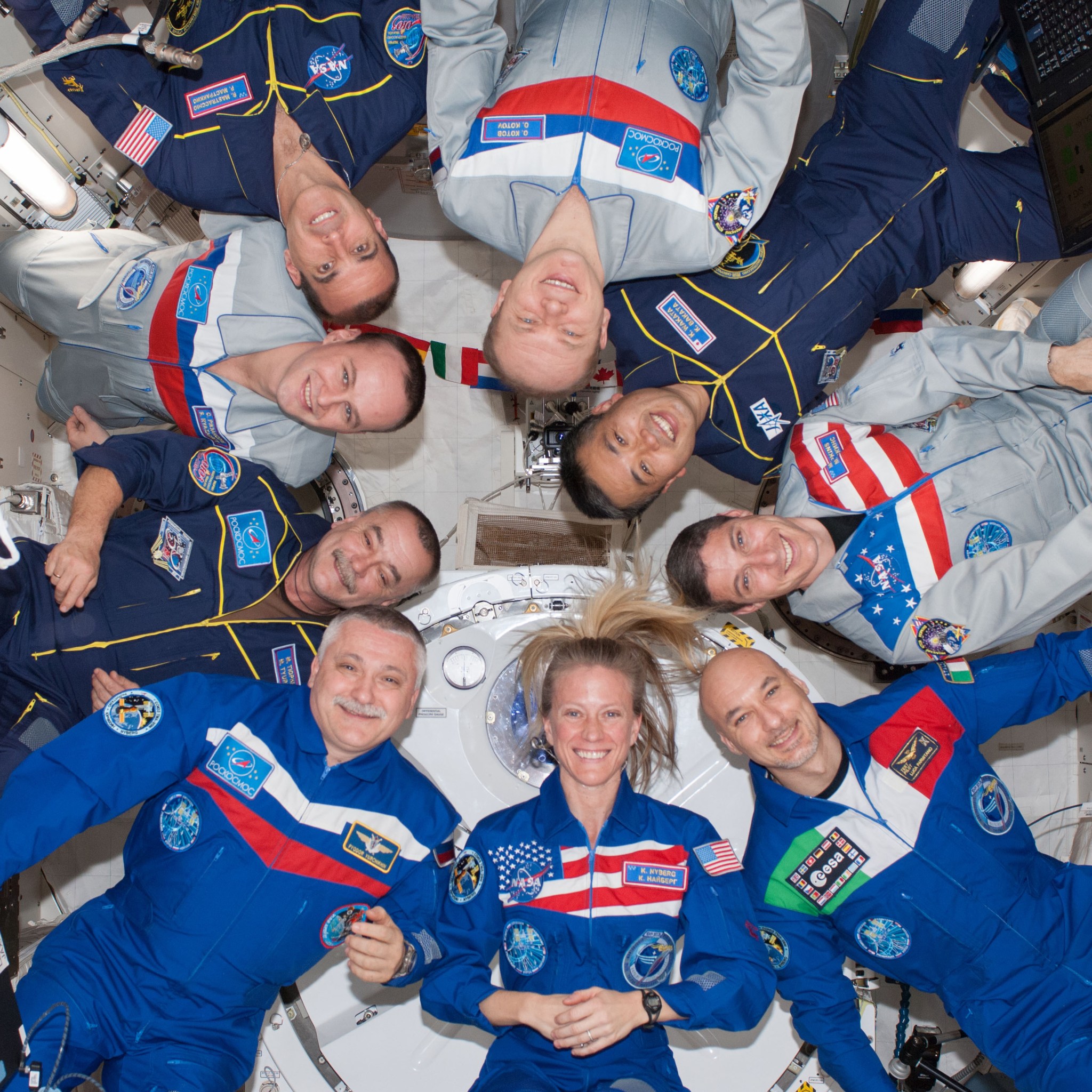 Nine crew members gather for a group portrait in the International Space Station's Kibo laboratory following a joint crew news conference. This is the first time since October 2009 that nine people have resided on the station without the presence of a space shuttle.