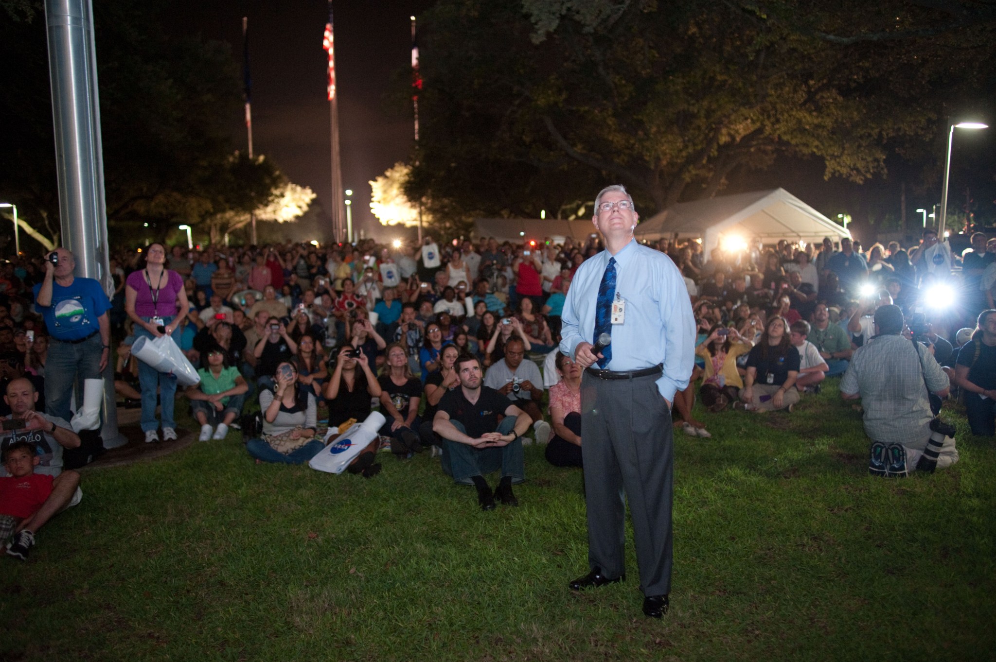 JSC Center Director Michael Coats and center employees watch the final landing of the space shuttle Atlantis and STS-135 crew