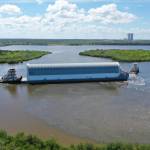NASA's Pegasus Barge makes its way along the intercoastal waterway to its destination at the Kennedy Space Center Launch Complex 39 turn basin wharf, to make its first delivery to Kennedy in support of the agency's Artemis missions. The upgraded 310-foot-long barge arrived Sept. 27, 2019, ferrying the 212-foot-long Space Launch System rocket core stage pathfinder. The pathfinder is a full-scale mock-up of the rocket's core stage. The pathfinder will be used by the Exploration Ground Systems Program and their contractor, Jacobs, to practice offloading, moving and stacking maneuvers, using important ground support equipment to train employees and certify all the equipment works properly. The pathfinder will stay at Kennedy for approximately one month before trekking back to NASA's Michoud Assembly Facility in Louisiana.