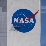 Painting of the NASA logo on the 525-foot-tall Vehicle Assembly Building.
