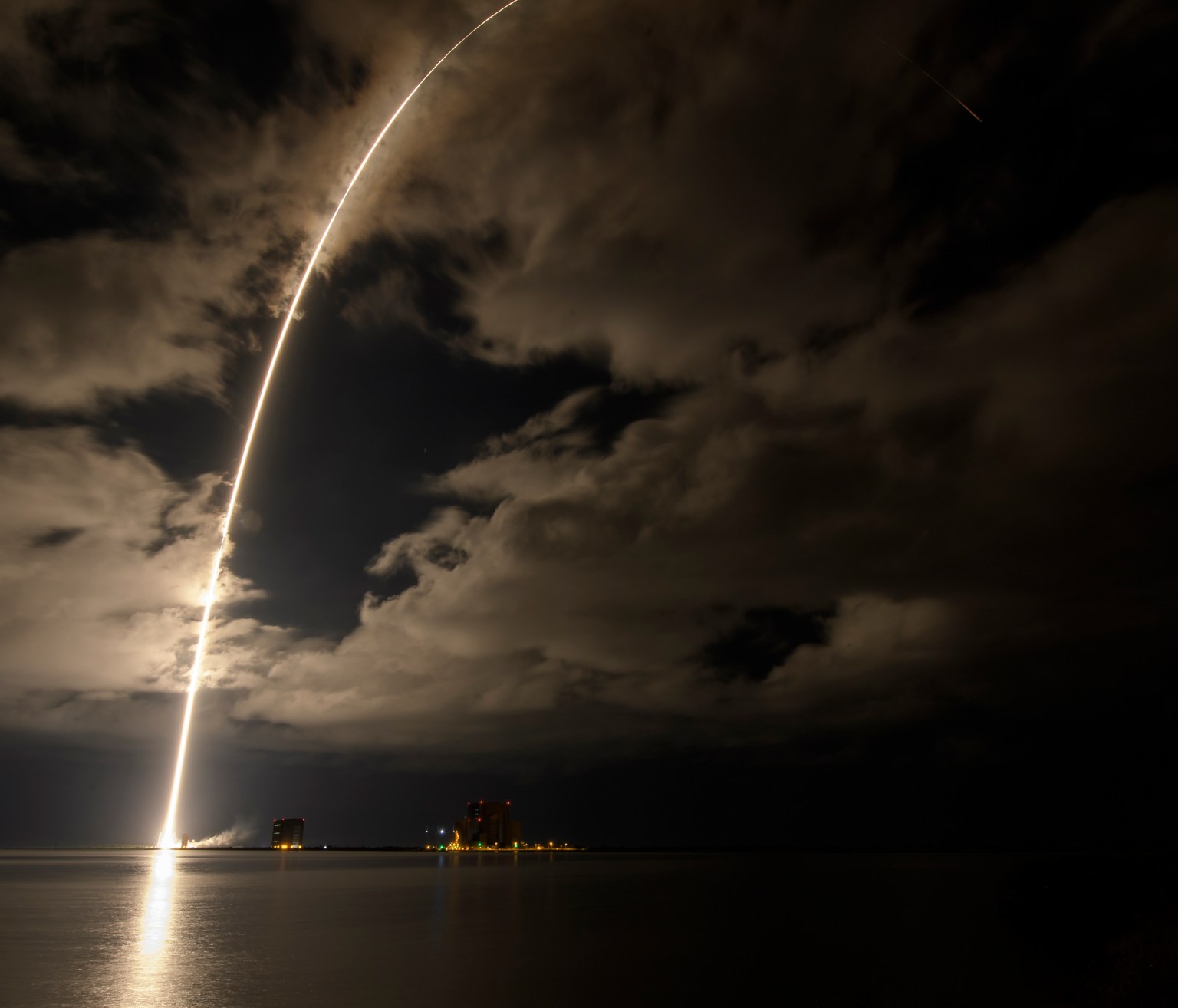 A United Launch Alliance Atlas V rocket with the Lucy spacecraft aboard is seen in this 2 minute and 30 second exposure photograph as it launches from Space Launch Complex 41, Saturday, Oct. 16, 2021, at Cape Canaveral Space Force Station in Florida. Lucy will be the first spacecraft to study Jupiter's Trojan Asteroids. Like the mission's namesake – the fossilized human ancestor, "Lucy," whose skeleton provided unique insight into humanity's evolution – Lucy will revolutionize our knowledge of planetary origins and the formation of the solar system.