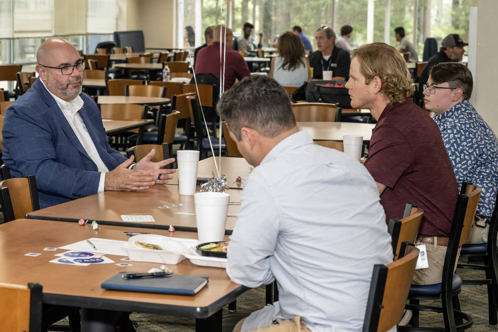 NASAs Marshall Space Flight Center Deputy Director Joseph Pelfrey talks with team members during the first Meals with Mentors lunch at the cafeteria in Building 4203 on June 6.