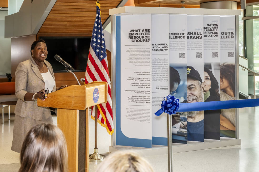 Tora Henry welcomes everyone to the ribbon-cutting ceremony. As ODEOs newest director, Henry serves as a diversity manager and helps lead the anti-harassment program at Marshall, among other duties.