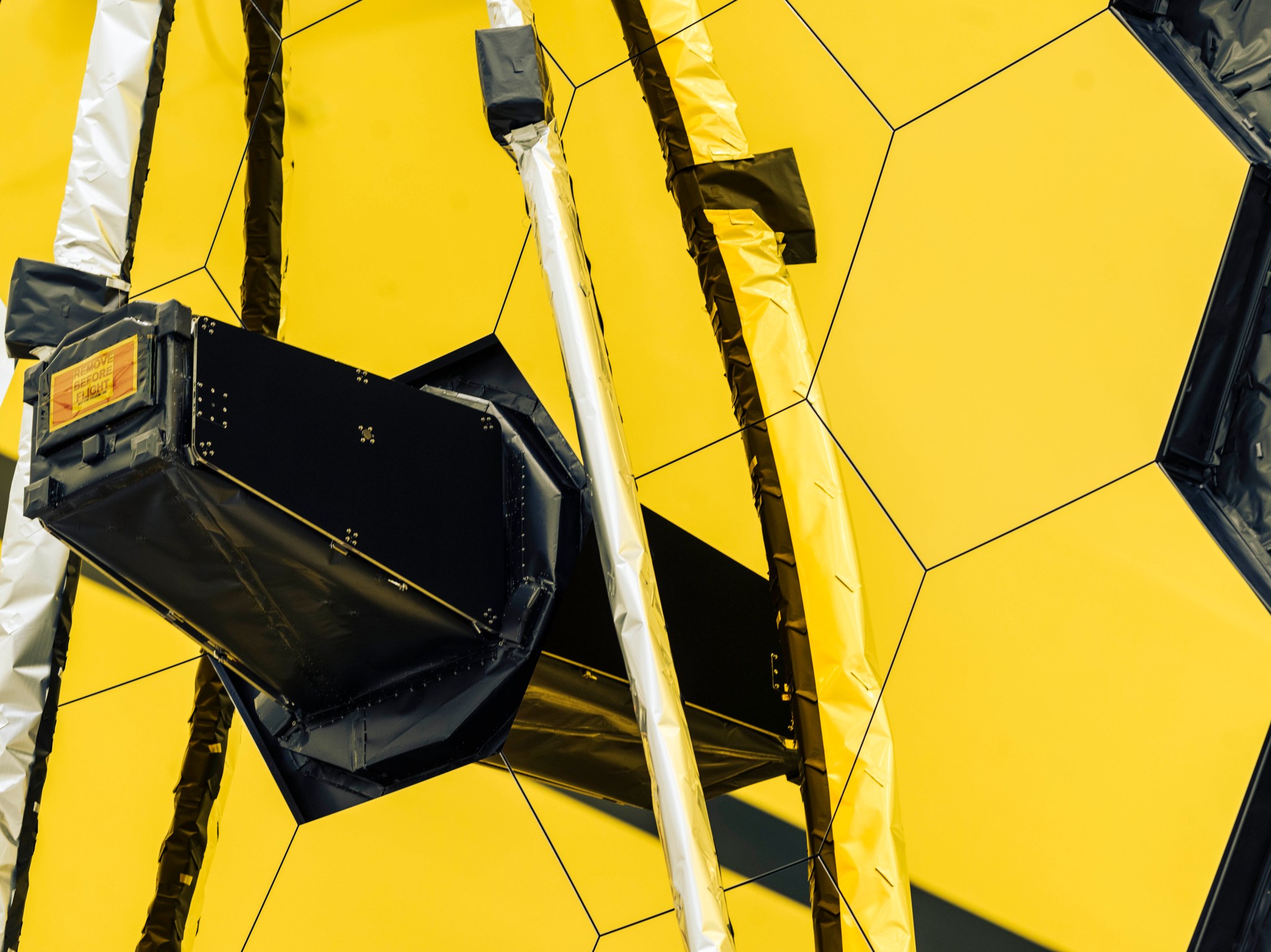 NASA’s James Webb Space Telescope is seen with one of its primary mirror wing panels fully extended during one of its final preflight tests.