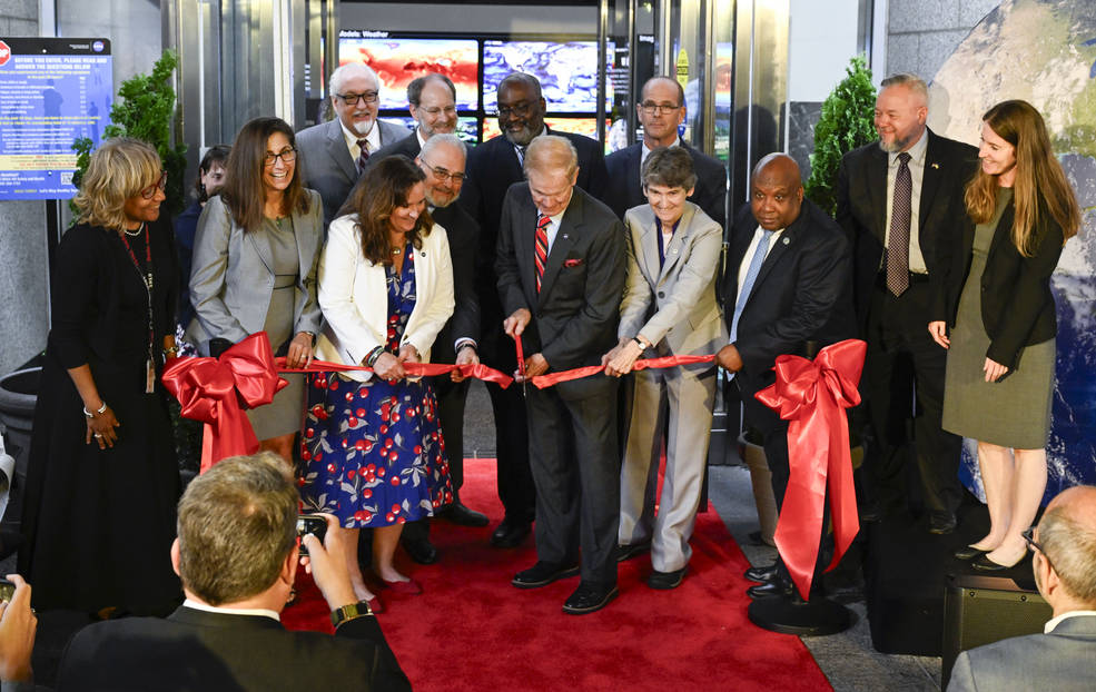 NASA Administrator Bill Nelson, center, cuts the ribbon to open NASAs Earth Information Center alongside agency leadership and leadership from NOAA, USGS, USDA, USAID, EPA, and FEMA.