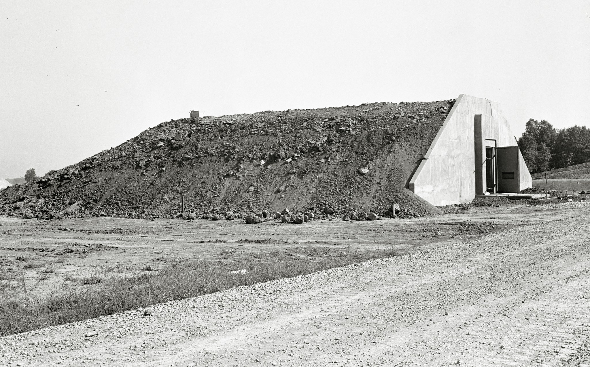Rectangular bunker covered with earth.