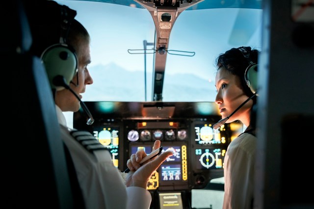 Air Traffic Control Problem 4 image showing two pilots a male and female inside the cockpit of an airplane.