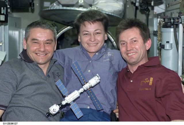 The Expedition 5 crew poses for a portrait in the Zvezda Service module of the International Space Station (ISS).