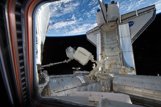 The AMS was removed from the shuttle's payload bay with its Canadarm robotic arm and handed off to the station's Canadarm2 for installation on the S3 truss.
