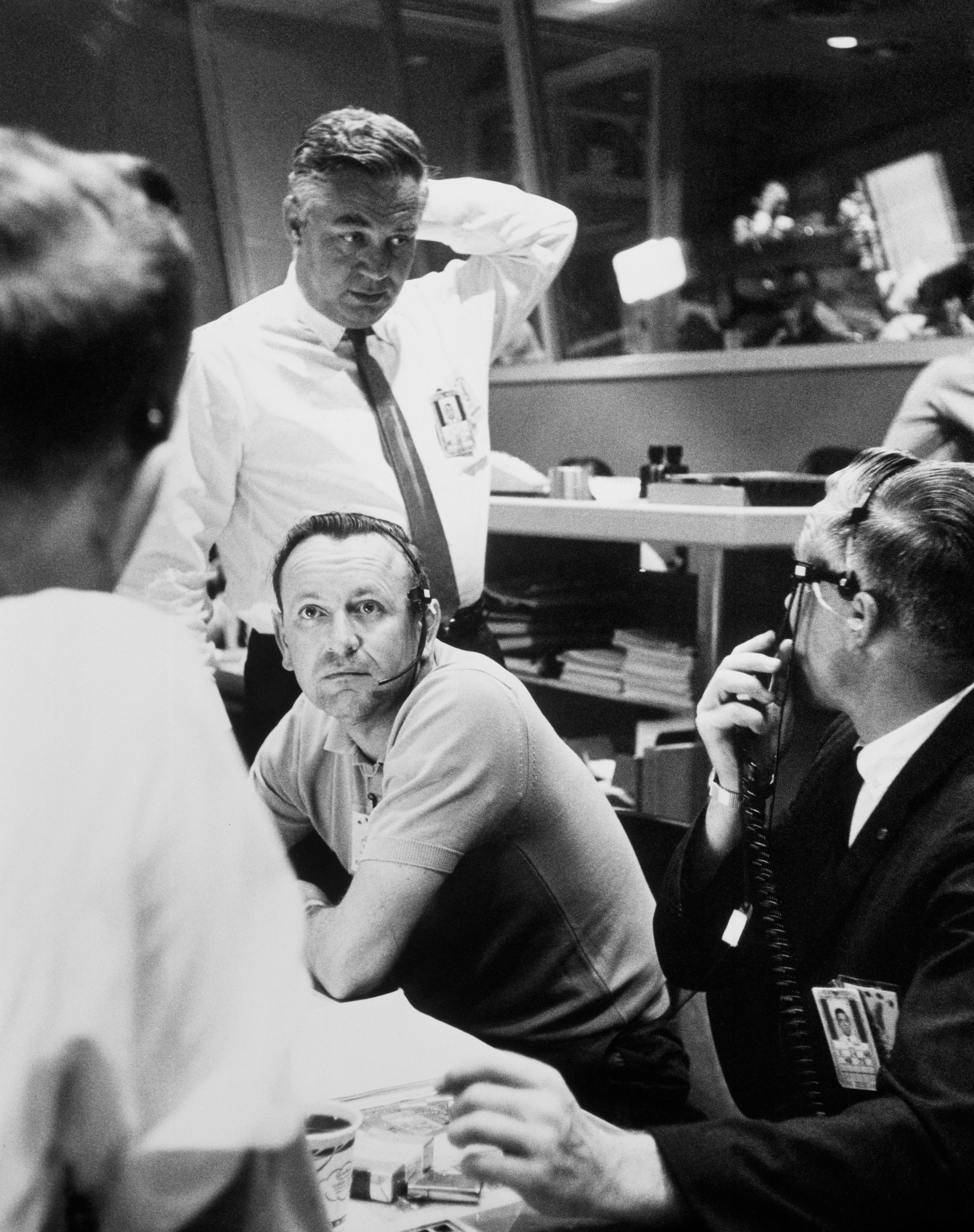 Chris Kraft, Chief of the Flight Operations Division, Manned Spacecraft Center, is shown in Mercury Control Center at Cape Canaveral, Florida, as the decision to go for the full 22 orbits is made. (22 May 1963)