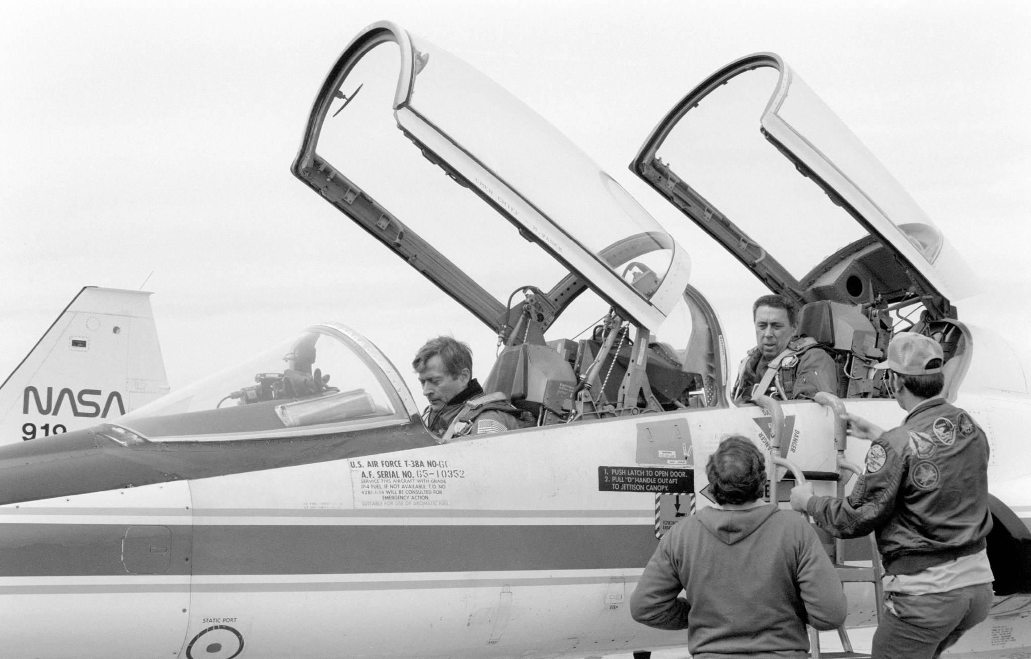 George Abbey, Director of Flight Crew Operations, and John W. Young, Chief of the Astronaut Office, leaving Ellington AFB in a T-38 aircraft