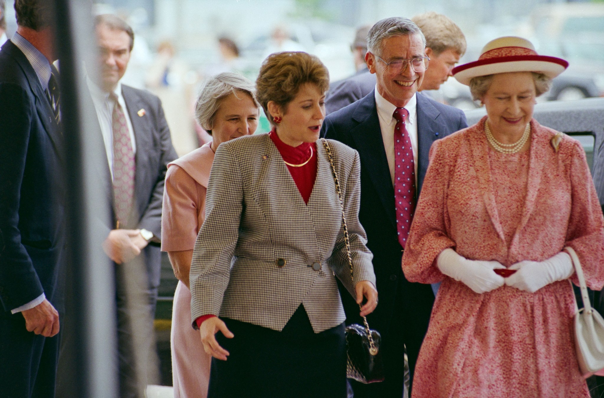 Johnson Space Center Director Aaron Cohen walking with Houston Mayor Kathy Whitmire and Queen Elizabeth II of England during her visit to Johnson.