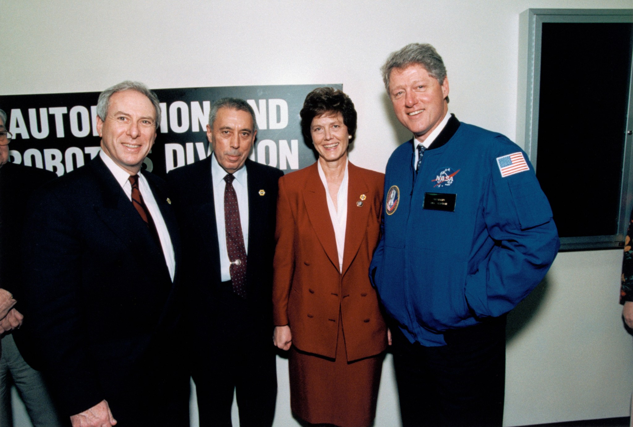 United States President Bill Clinton tours facilities and talks NASA Administrator Daniel S. Goldin, JSC Deputy Director George W.S. Abbey, and Center Director Carolyn L. Huntoon.
