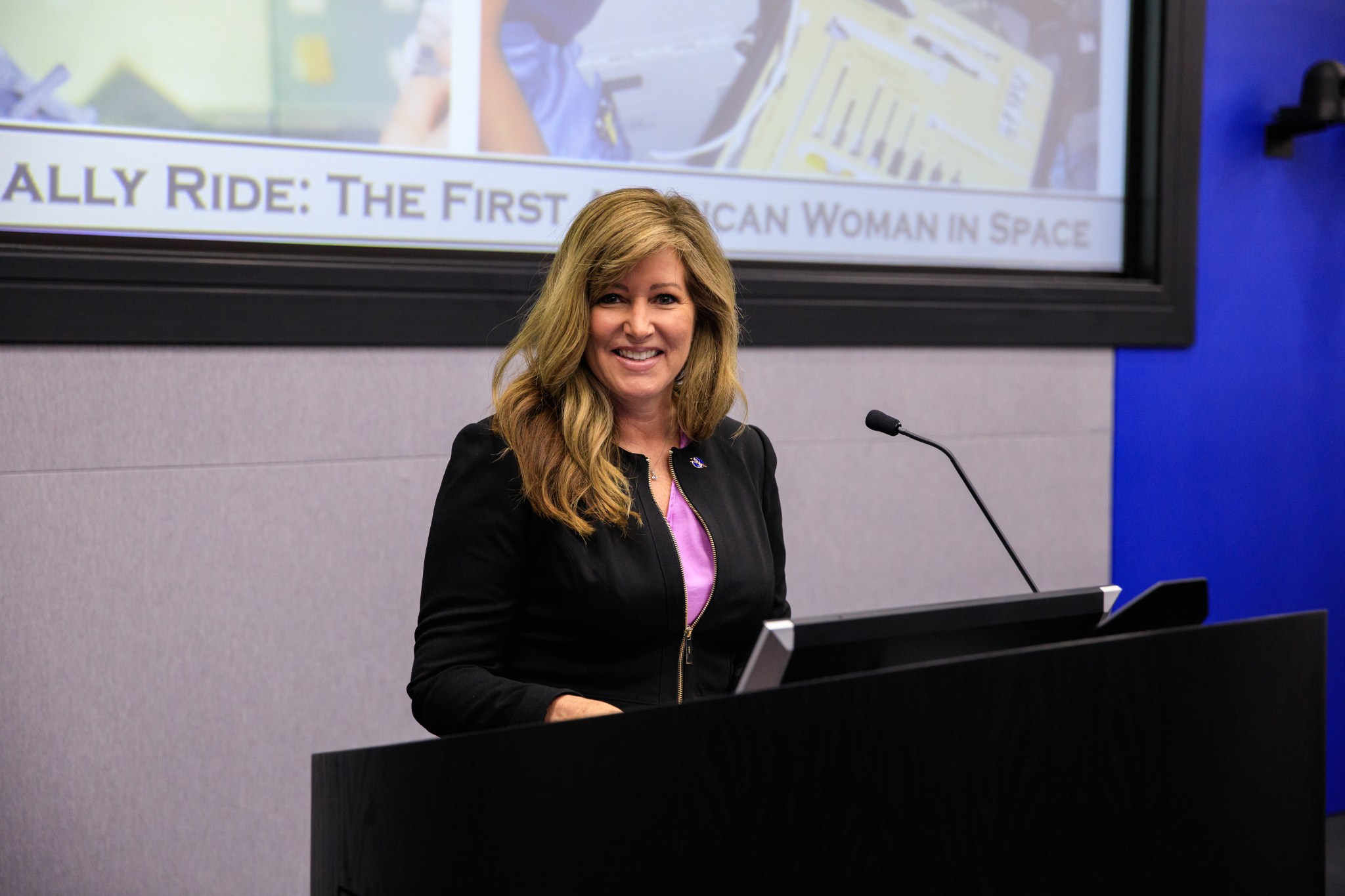 Kennedy Space Center Associate Director, Technical, Jennifer Kunz addresses an audience during a celebration of former astronaut Sally Ride event.