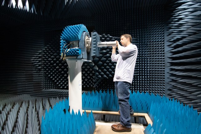 photo of man testing technology in a chamber
