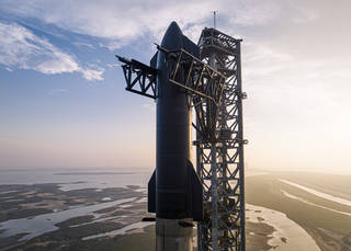 SpaceXs Starship rocket sits on a launch pad at the companys Starbase in Texas.