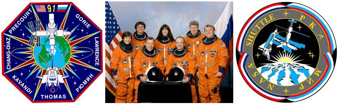 Left: The STS-91 crew patch. Middle: The STS-91 crew of Wendy B. Lawrence, left, Franklin R. Chang-Díaz, Dominic L. Gorie, Janet L. Kavandi, Charles J. Precourt, Valery V. Ryumin, and Andrew S.W. Thomas. Right: The official Phase 1 Shuttle-Mir Program patch.