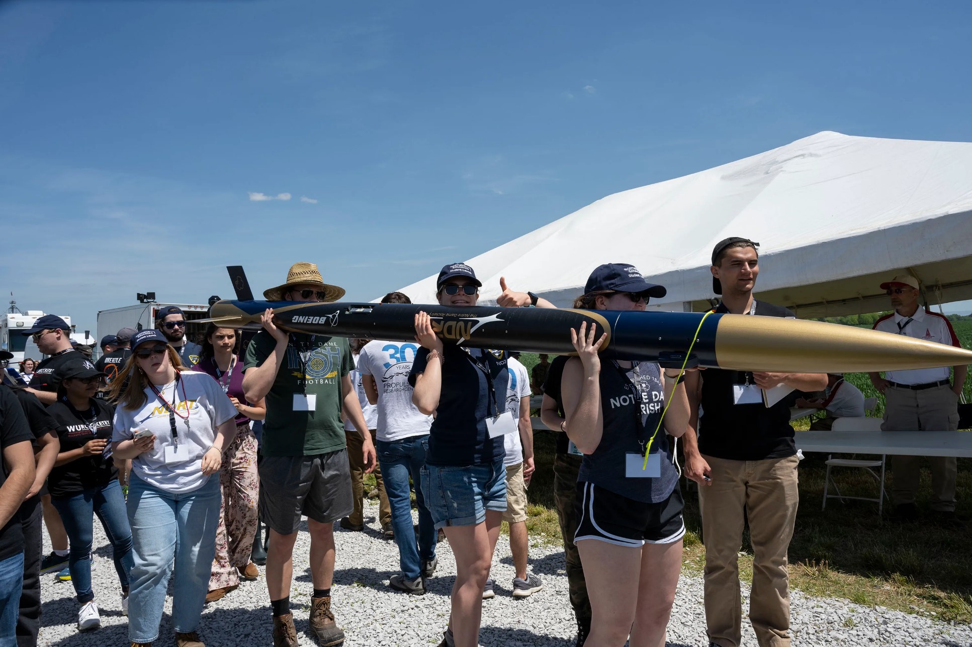 The University of Notre Dame team carries their rocket to the launch pad during the 2022 NASA Student Launch competition.