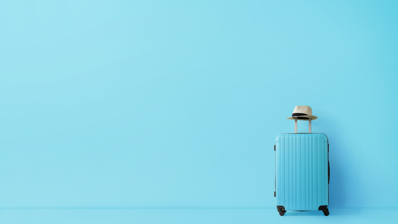 blue suitcase on a blue background