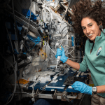 NASA astronaut Jasmin Moghbeli services microbe samples for DNA sequencing aboard the International Space Station.